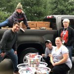 Three Rivers Community College students Cody Sowell, Thena Cranfill, Joe Victorino, Marie Parry and Samantha Bartosiak load a pick-up truck with turkeys and Thanksgiving fixings to bring to the Norwich Vet Center.