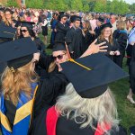 Graduate hugs professor at Three Rivers graduation.