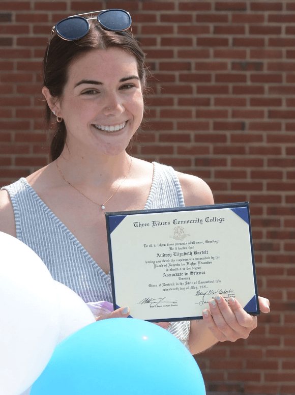 Audrey Bartlet smiling with her degree