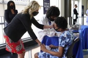 first lady jill biden comforting teen getting the covid 19 vaccination shot