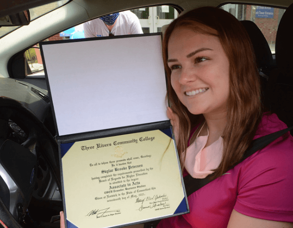 skylar peterson smiling with her degree
